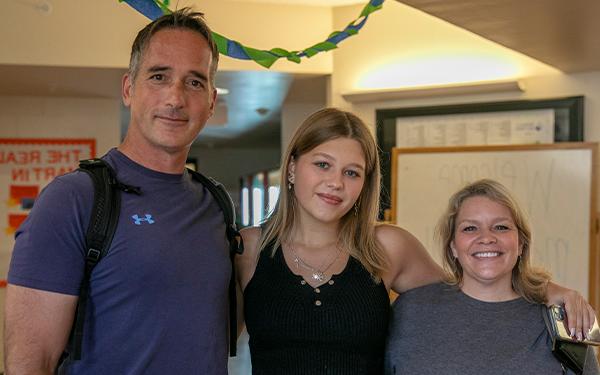 student pictured with parents